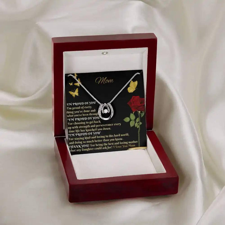 lucky in love necklace in mahogany box angled right