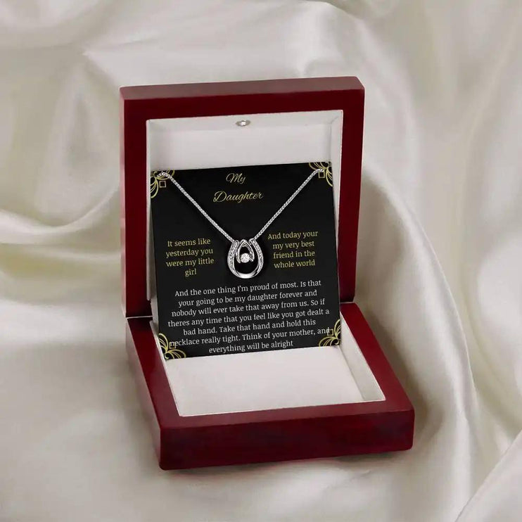 lucky in love necklace with a white gold pendant in a mahogany box angle 3