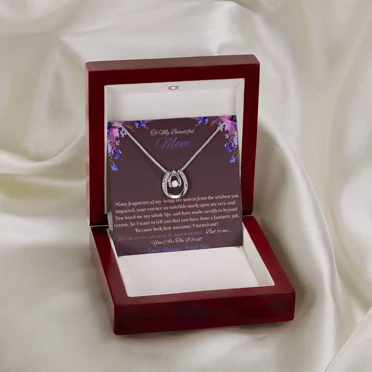 lucky in love necklace in mahogany box on white cloth