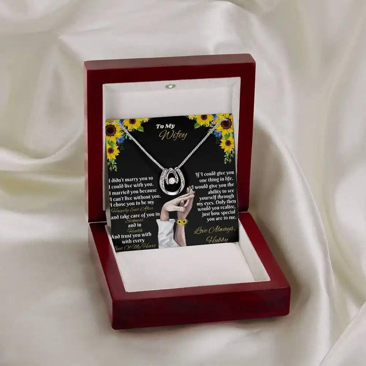 white gold lucky in love necklace in mahogany box on white cloth