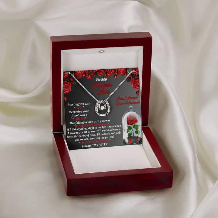 white gold lucky in love necklace in mahogany box on white cloth