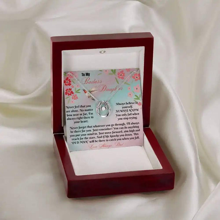 white gold lucky in love necklace in mahogany box on white cloth