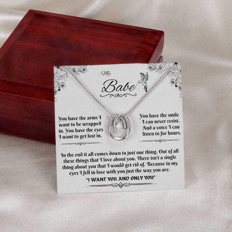 lucky in love necklace outside a closed luxury box on a message card