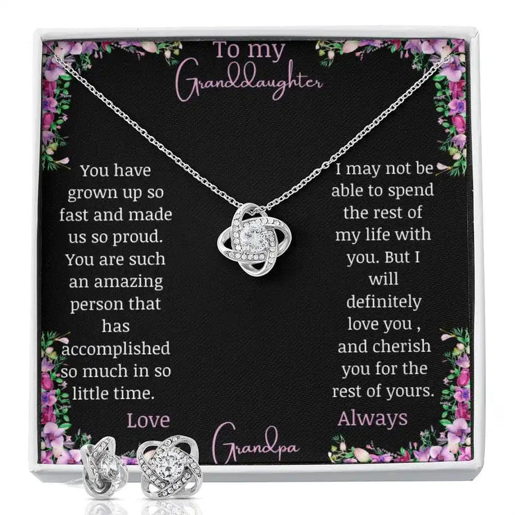 Love Knot Necklace Love Knot Earring Set with a white gold pendant and a to granddaughter from grandma greeting card with earrings at the bottom close up