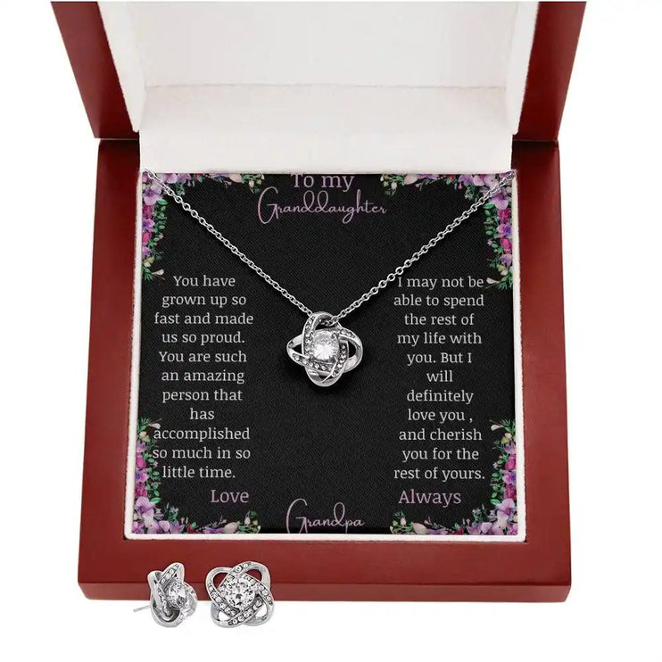 Love Knot Necklace Love Knot Earring Set with a white gold pendant and a to granddaughter from grandma greeting card in a mahogany box with earrings at the bottom