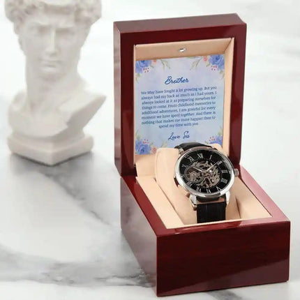 A Men's Open work Watch and to brother greeting card inside a mahogany box different angle.