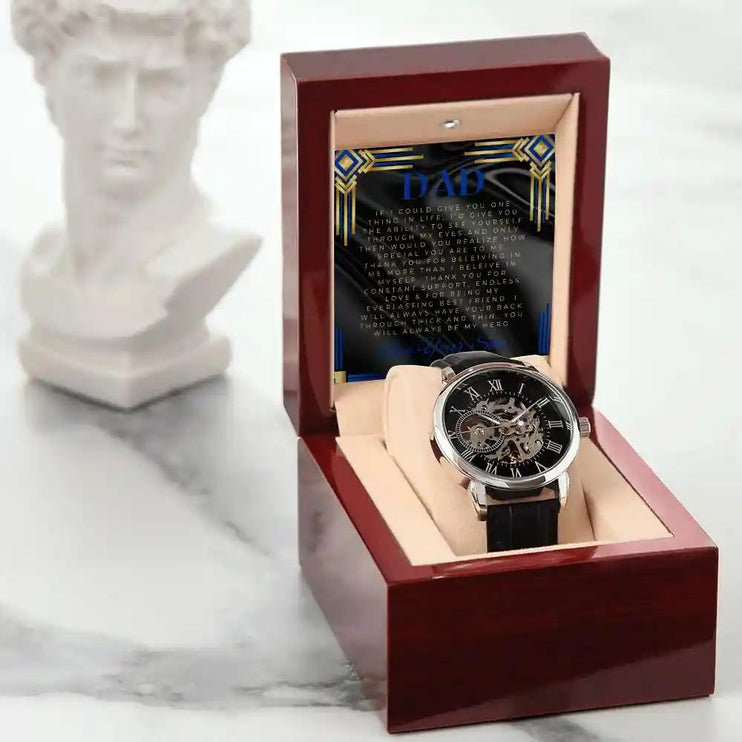 Men's Openwork Watch with to dad greeting card in a mahogany box with a statue beside it