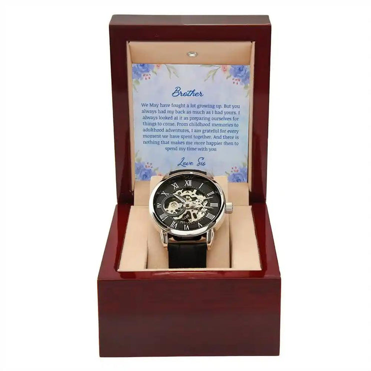 A Men's Open work Watch and to brother greeting card inside a mahogany box.