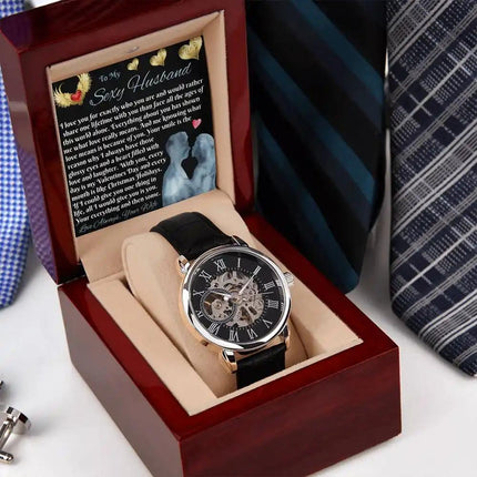 mens openwork watch laying down in mahogany box
