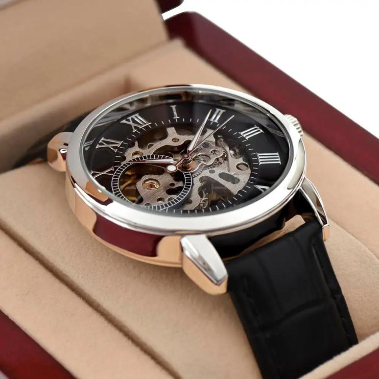 mens openwork watch up close in mahogany box