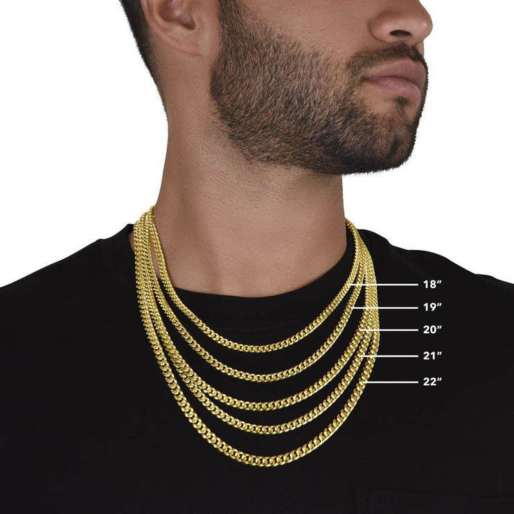 gold Cuban link chain showing adjustable sizes on model's neck