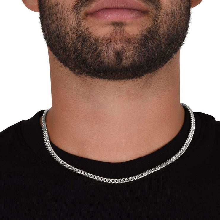 stainless-steel Cuban link chain on model's neck