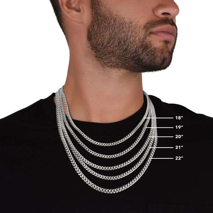 stainless-steel Cuban link chain on model's neck showing different sizes