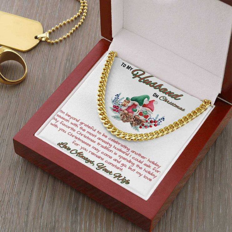 yellow gold Cuban link chain in a luxury box angled to the right