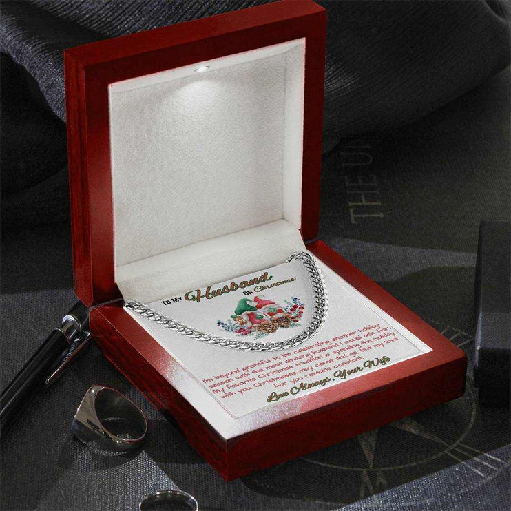 stainless-steel Cuban link chain in a luxury box angled to the left