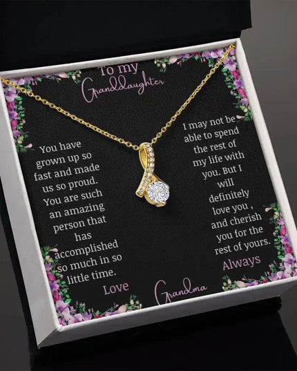 Alluring Beauty Necklace with a yellow gold charm with a to granddaughter from grandma greeting card in a two-tone box angled to right side