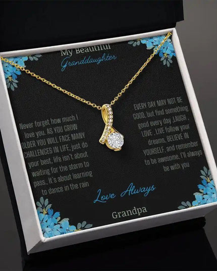 Alluring Beauty Necklace with a yellow gold charm with a to granddaughter from grandpa greeting card in a two-tone box angled slightly to right