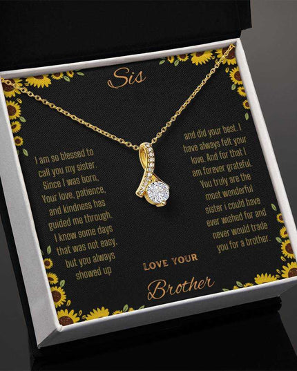Alluring Beauty Necklace with a yellow gold variant on a To Sis from Brother greeting card in a two-tone box angled slightly to the left with a close up view