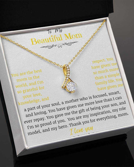 A yellow gold Alluring Beauty Necklace up close angled to the left.