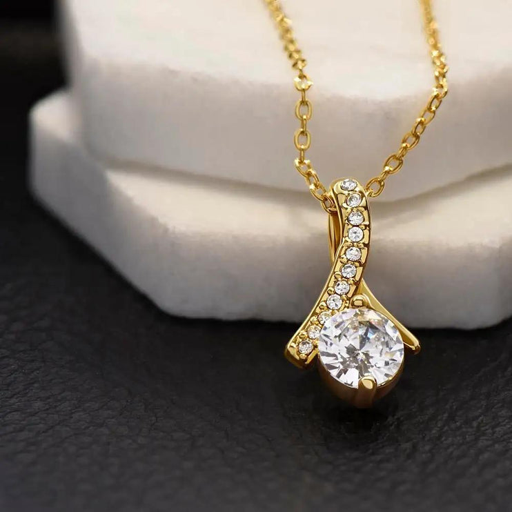 yellow gold alluring beauty necklace on a white display