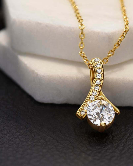 yellow gold alluring beauty necklace on a white display 