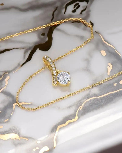 yellow gold alluring beauty necklace on marble table
