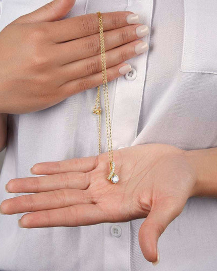 yellow gold alluring beauty necklace in a model's hand