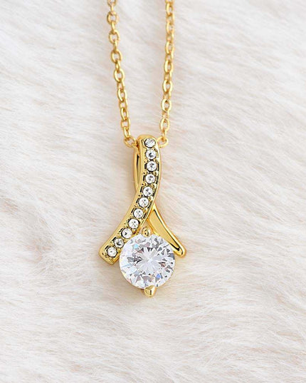yellow gold alluring beauty necklace on a white felt cloth