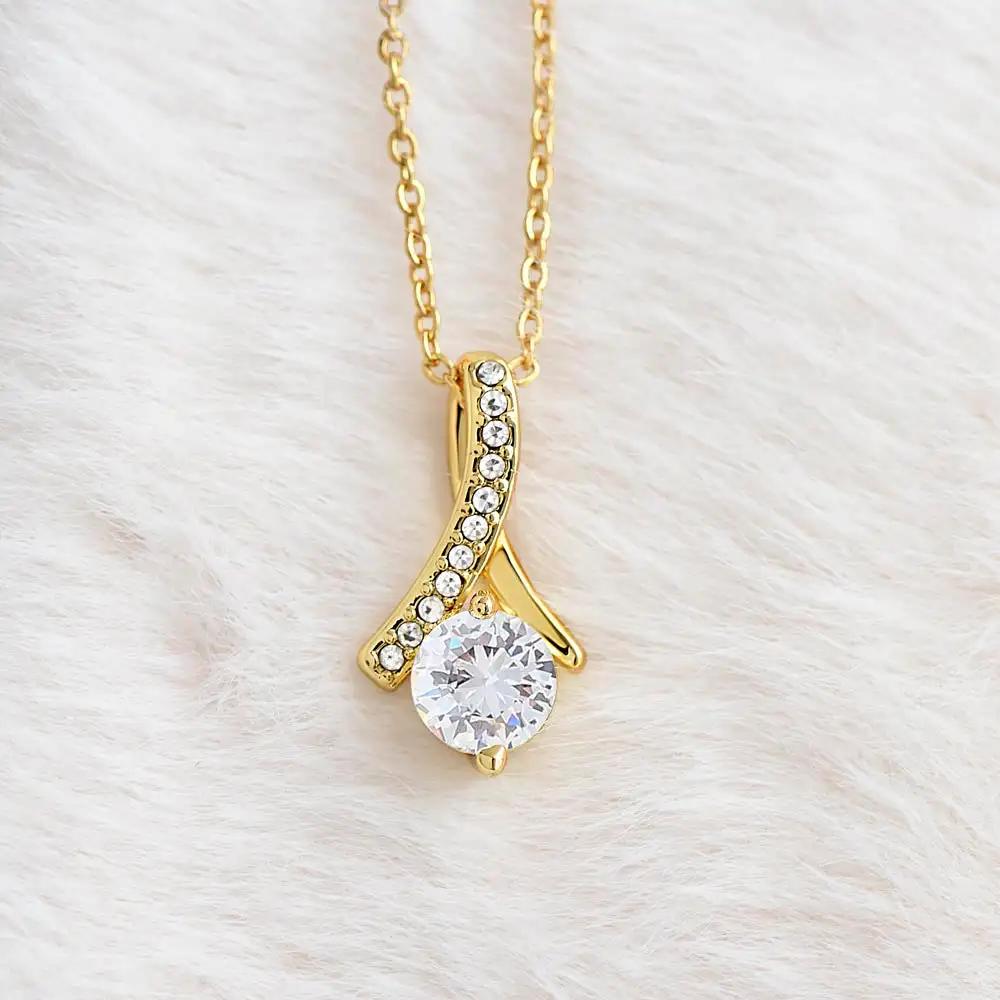 yellow gold alluring beauty necklace on white fleece