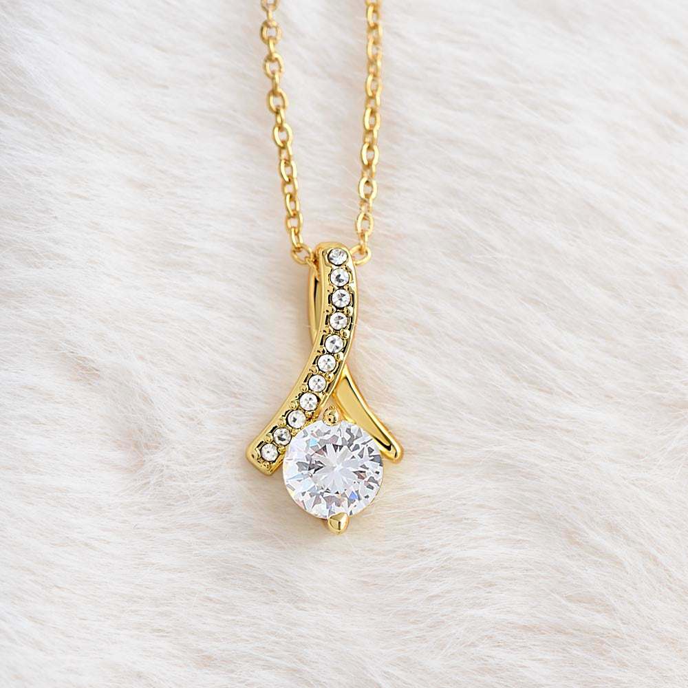 yellow gold alluring beauty necklace on a white cloth