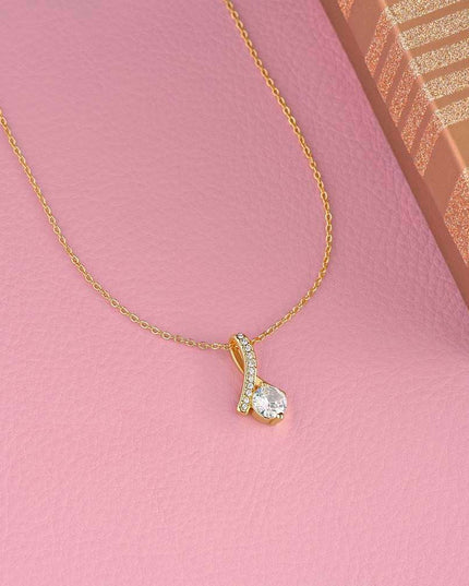 yellow gold alluring beauty necklace on a pink display table