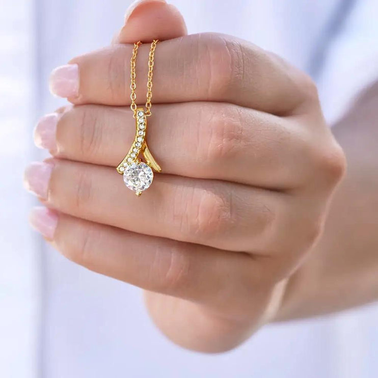 yellow gold alluring beauty necklace in models' hand