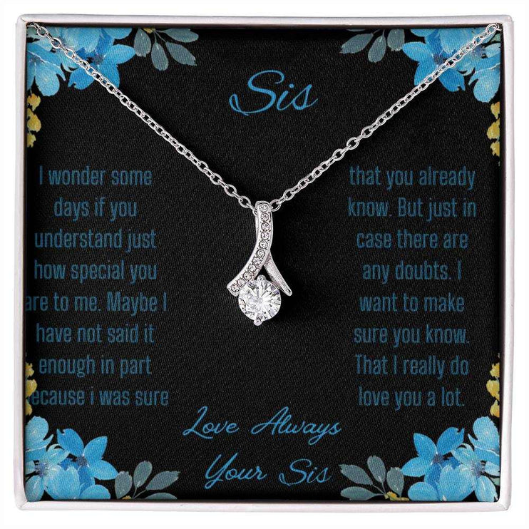 Alluring Beauty Necklace with a white gold variant on a to sis from sis greeting card with a close up view.