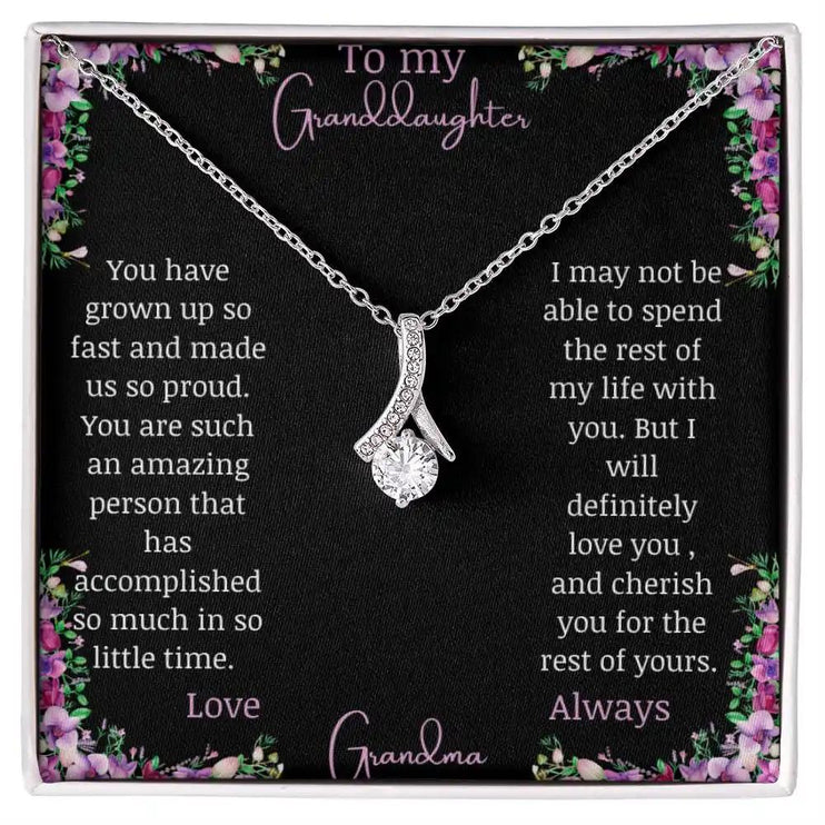Alluring Beauty Necklace with a white gold charm with a to granddaughter from grandma greeting card up close