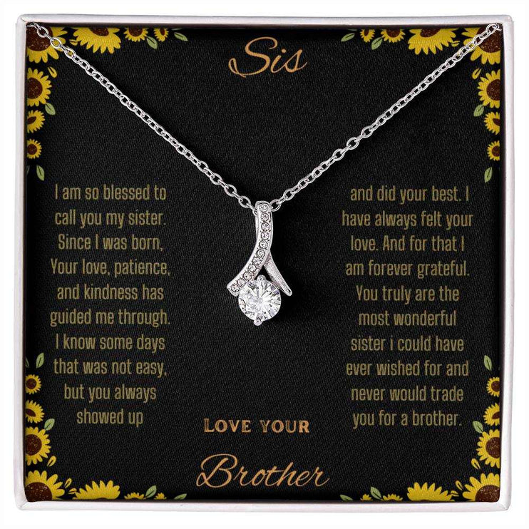 Alluring Beauty Necklace with a white gold variant on a To Sis from Brother greeting card close up view