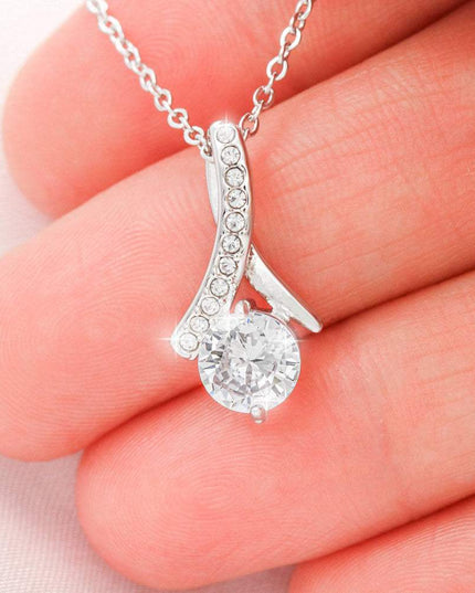 white gold alluring beauty necklace in model's hand