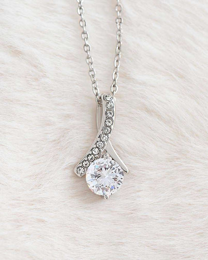 white gold alluring beauty necklace on a white felt cloth 