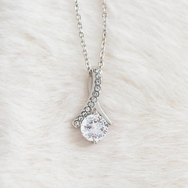 white gold alluring beauty necklace on a white fleece