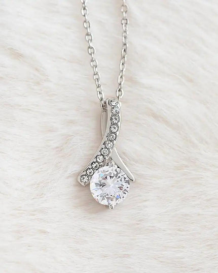 white gold alluring beauty necklace on white fleece