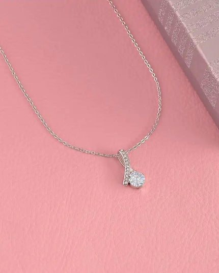 white gold alluring beauty necklace on pink table