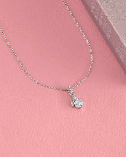 white gold alluring beauty necklace on a pink display table