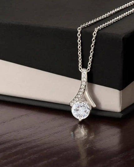 white gold alluring beauty necklace on top of a two-tone box