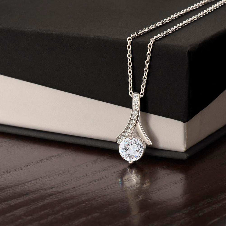 white gold alluring beauty necklace on top of soft box