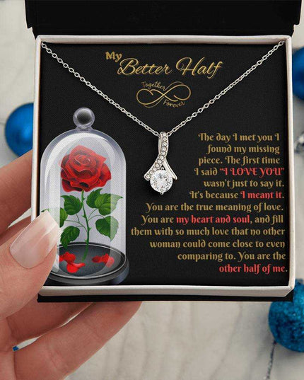 white gold alluring beauty necklace in soft box in model's hand