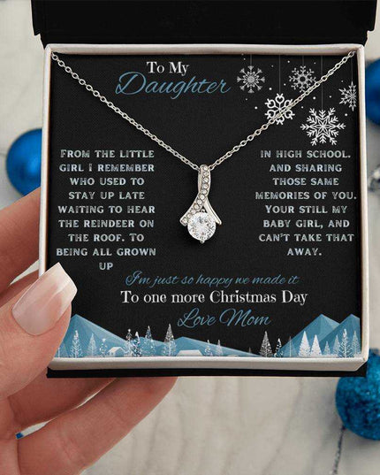 white gold alluring beauty necklace in soft box in model's hand