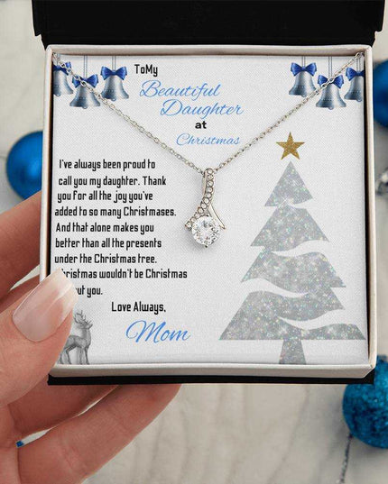 white gold alluring beauty necklace in a soft box in model's hand