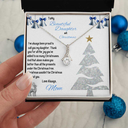 white gold alluring beauty necklace in a soft box in model's hand