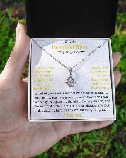 A white gold Alluring Beauty Necklace up close in a two-tone box.