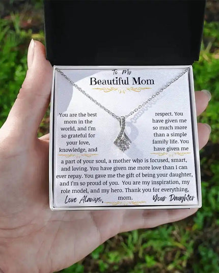 a white gold alluring beauty necklace in models hands
