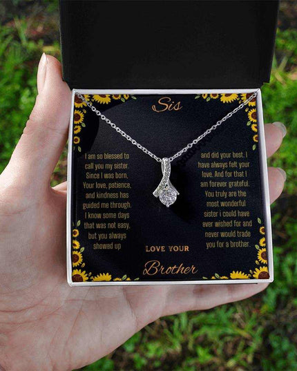 Alluring Beauty Necklace with a white gold variant on a To Sis from Brother greeting card inside a two-tone close up view